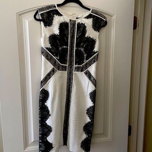 Cap sleeve white dress with black lace accents